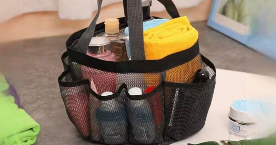 A mesh shower caddy filled with shower essentials