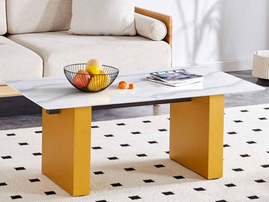 glass coffee table on top of a polka dot rug