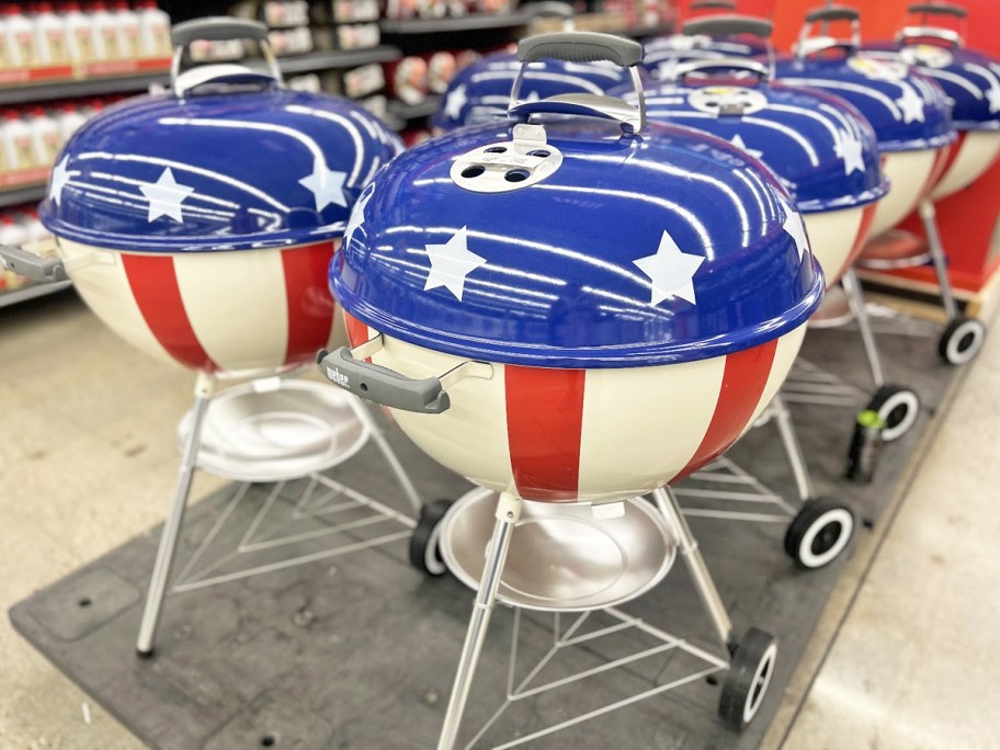 patriotic weber charcoal grills on display in store