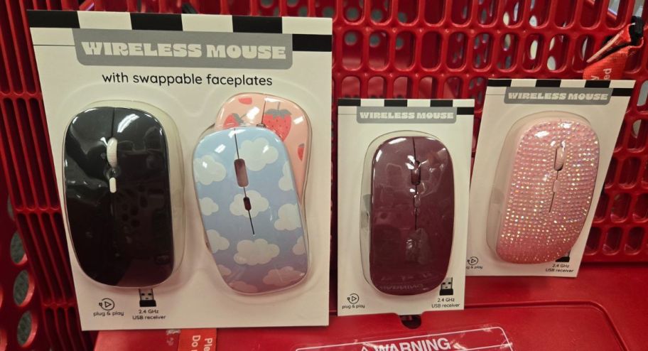 hand holding Wireless Mouse w Swappable Faceplates and wireless ones in pink