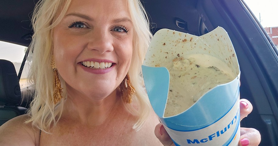 Woman holding the new McFlurry at McDonalds in her car