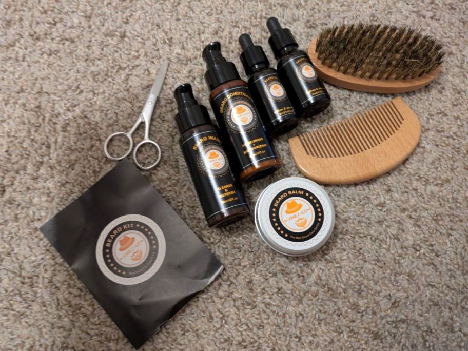 A men's beard kit on a beige carpet