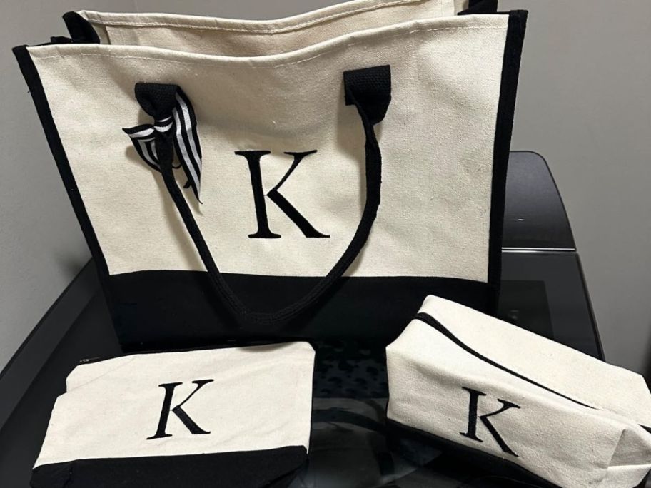 3 bags with the "K" initial embroidered on them