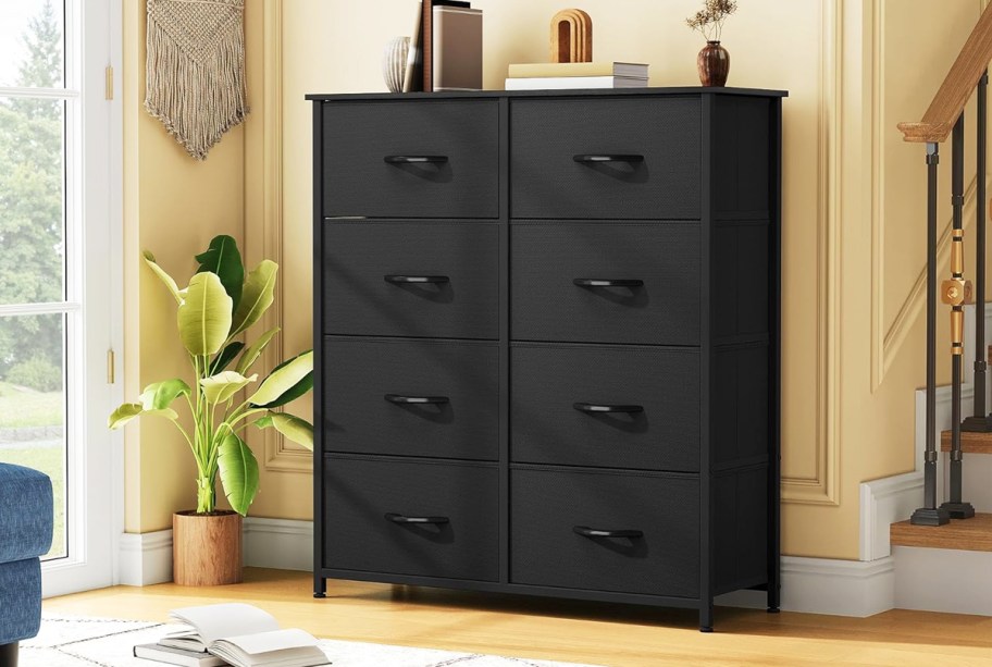 black 8-drawer dresser with fabric bins