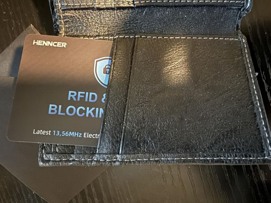 A black wallet with an RFD protection card in it 