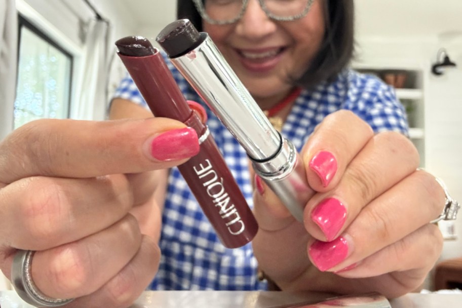 woman holding clinique lipstick and amazon alternative