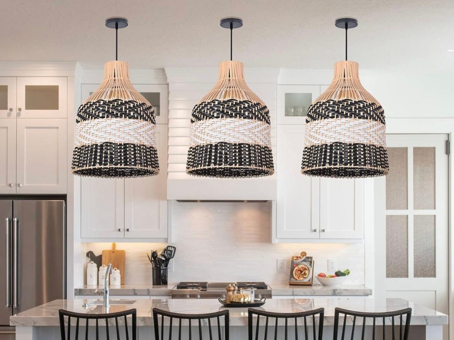 three black and white striped rattan pendant lights hanging in kitchen