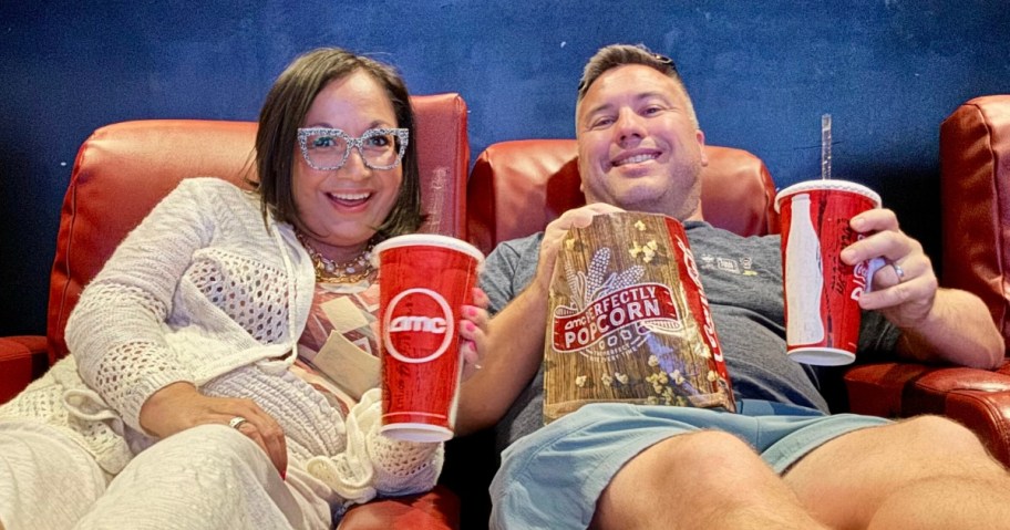 woman and man sitting in an amc theater