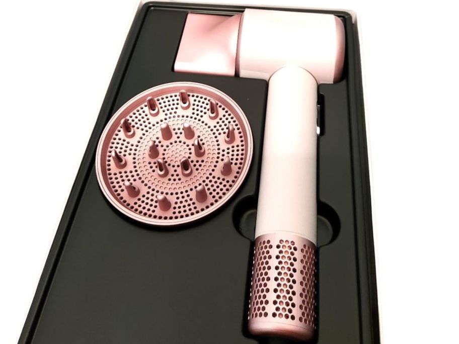 pink blow dryer with diffuser attachment in box