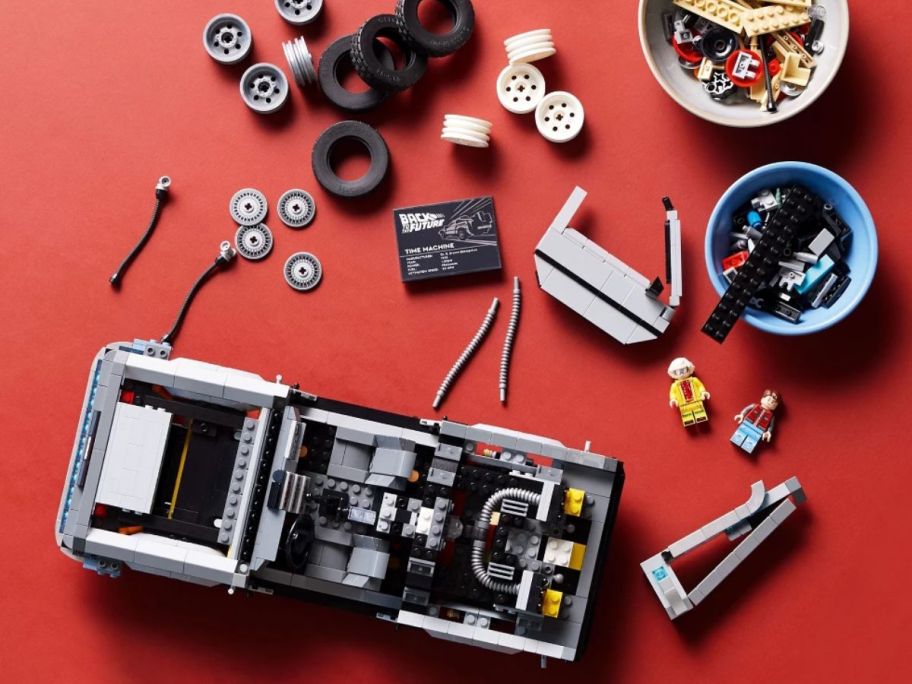 LEGO pieces to build a back to the future car with a red background