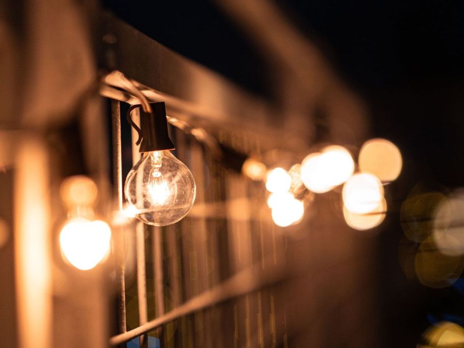Better Homes & Gardens 20-Count Glass Globe Outdoor String Lights hanging