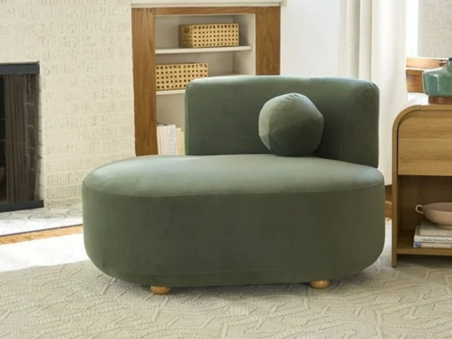 green velvet chaise chair in living room 