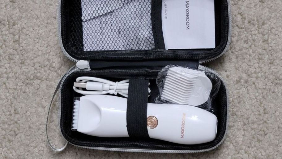 bikini trimmer shown with narrow blade attachment, 2 clipper guards, zip carry case, and charging cord