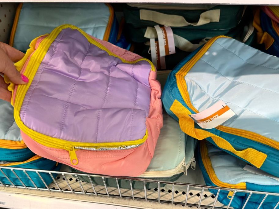 purple and orange Lunch Box on shelf in store