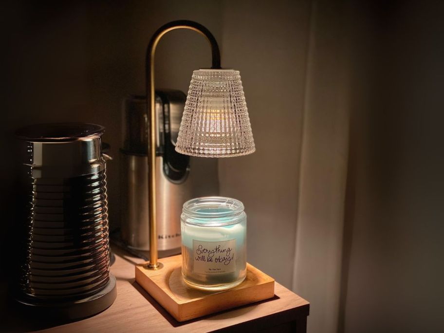 Candle Warmer Lamp with candle on it on side table