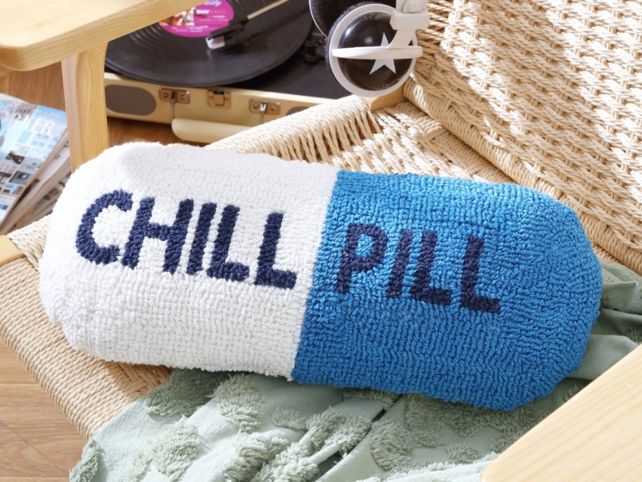 a pill shaped pillow on a chair