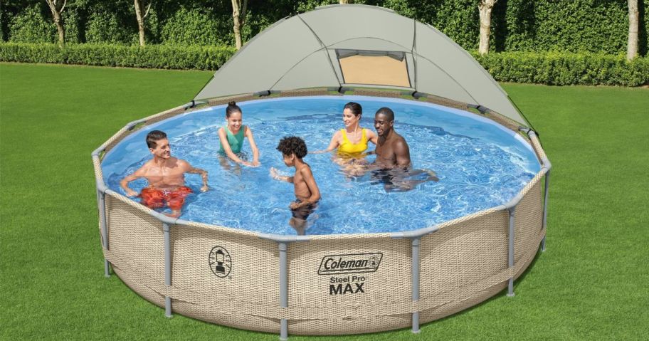 five people swimming in coleman above ground pool in yard
