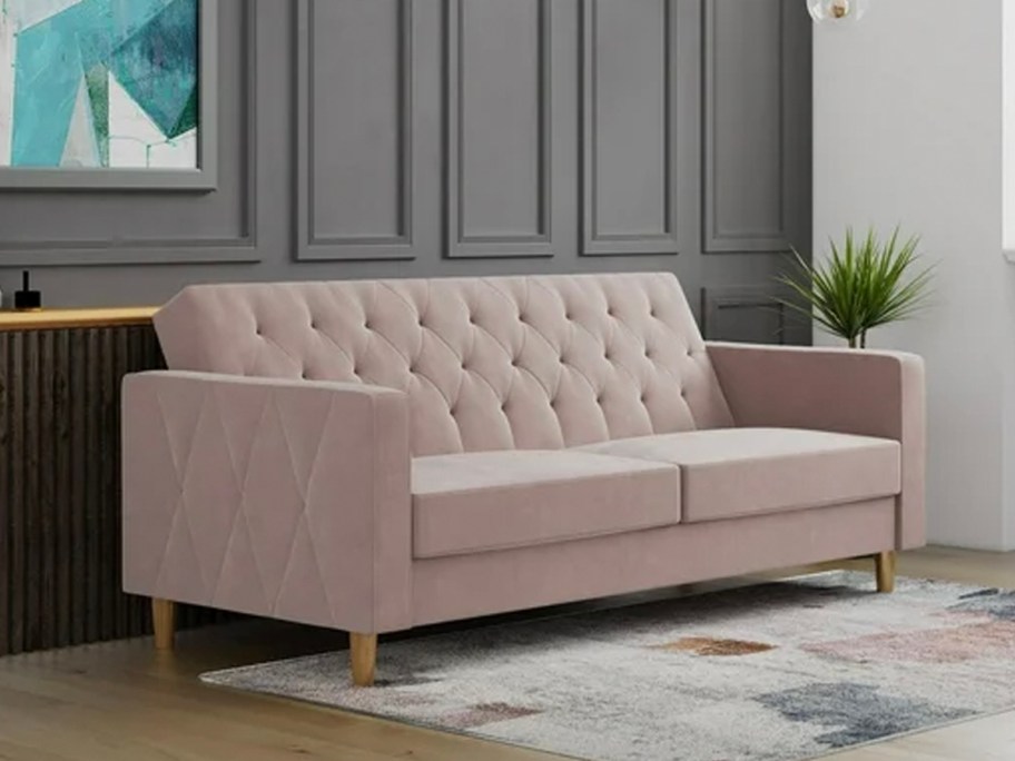 pink futon in living room 
