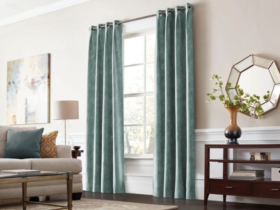 allen + roth 84" Room Darkening Thermal Lined Grommet Single Curtain Panels on window in living room