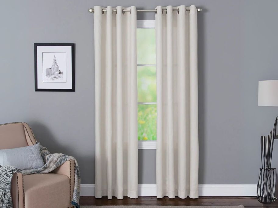 Style Selections 84" Light Filtering Grommet Single Curtain Panels on window in living room