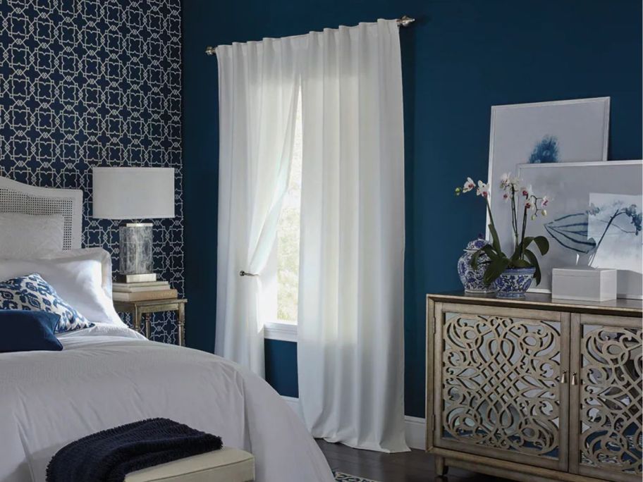 Style Selections 84" Ivory Blackout Thermal Lined Back Tab Single Curtain Panels on window in bedroom