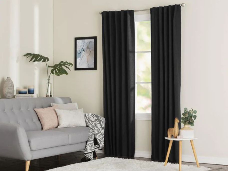 LIVING LOGIC 84" Black Blackout Thermal Lined Back Tab Single Curtain Panels on window in living room