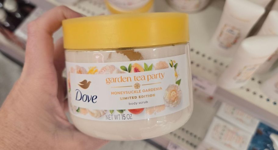 hand holding dove garden tea party scrub at the store