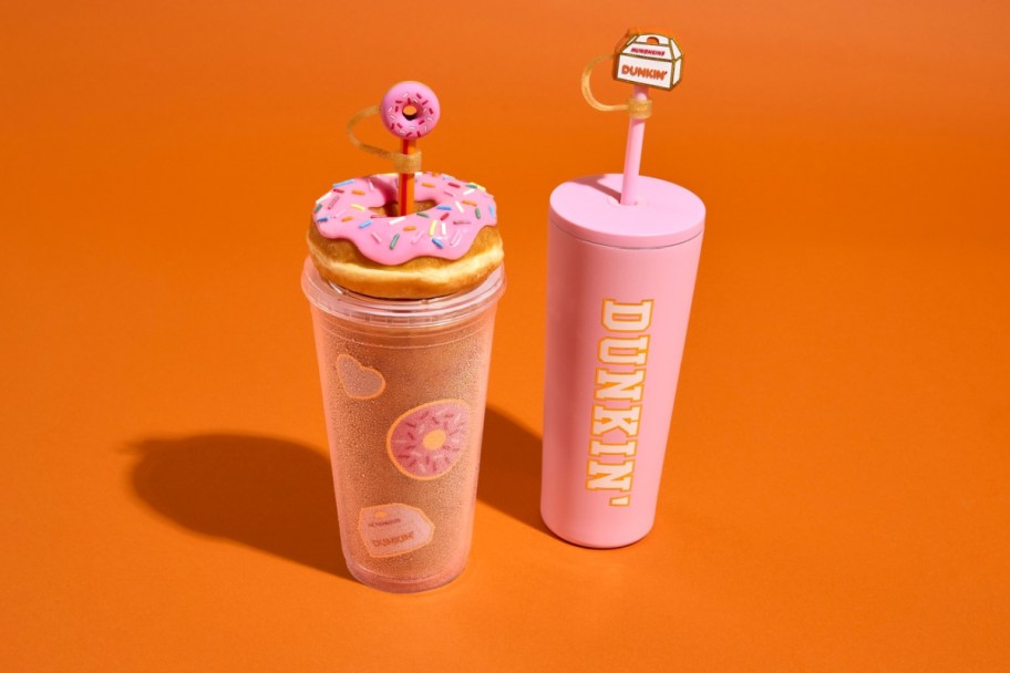 two dunkin donuts themed tumblers with straws and toppers
