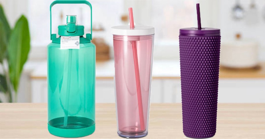 green water bottle, pink and purple tumblers on countertop 