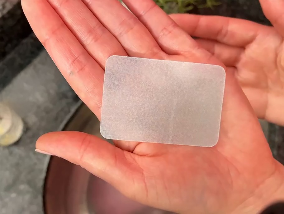 hand holding a soap sheet