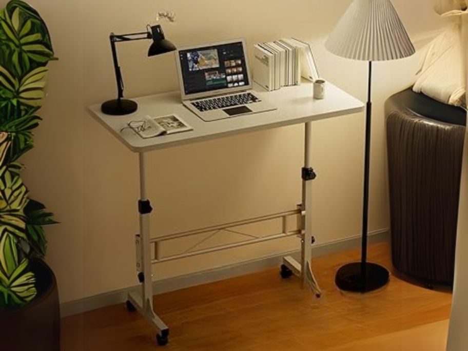 Mobile Stand Up Desk w/ Wheels against wall