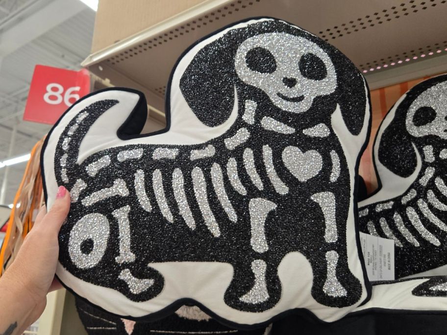 Ashland 16.5" Black & Silver Skeleton Dog Accent Pillow in hand in store
