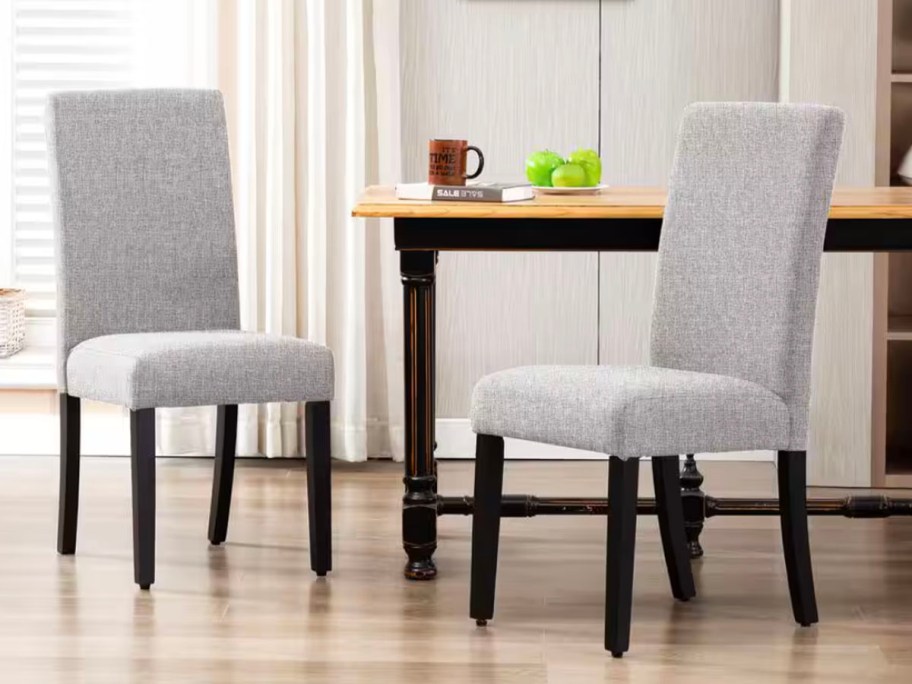 gray upholsered dining chairs next to table