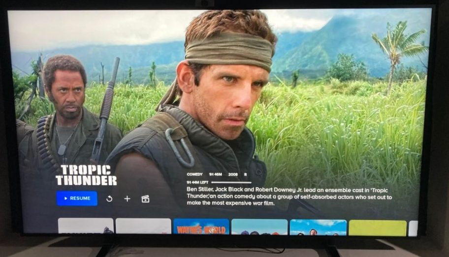 An iFFALCON 55" QLED 4K Smart TV w/ Art Mode $ with Tropic Thunder movie playing on the screen