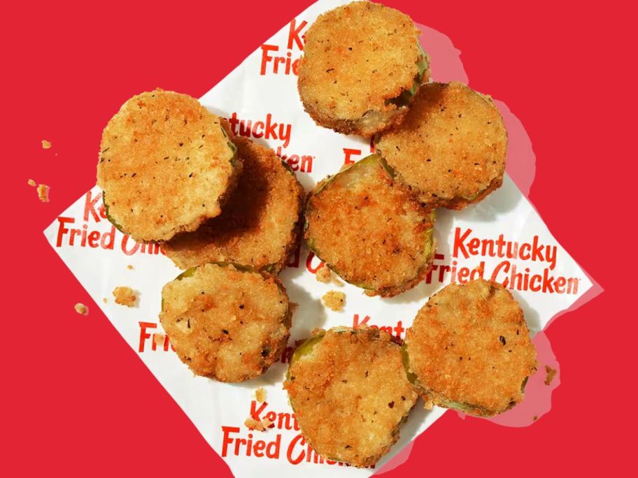 kfc fried pickles on paper in front of red background
