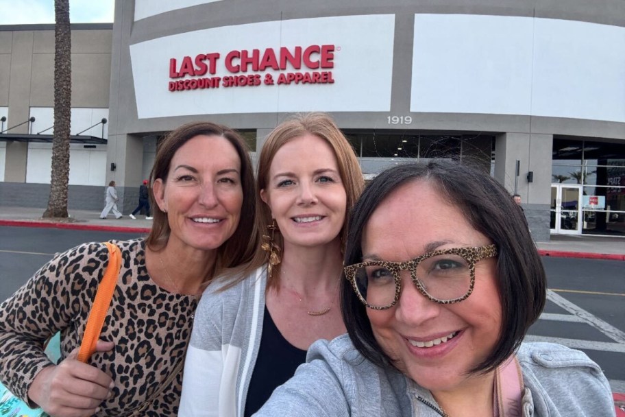 three ladies in front of last chance nordstrom outlet store