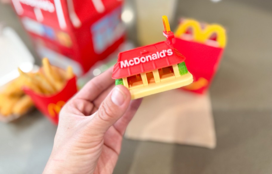 lil mcdonalds restaurant happy meal toy being held in hand