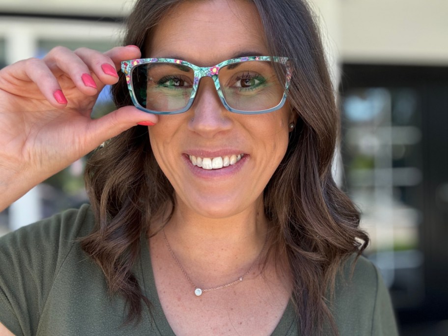 smiling woman wearing a pair of moana print eyeglasses