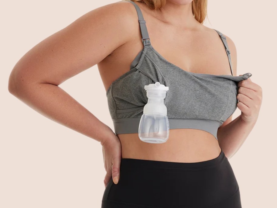 woman wearing a grey nursing bra with a pump on one side