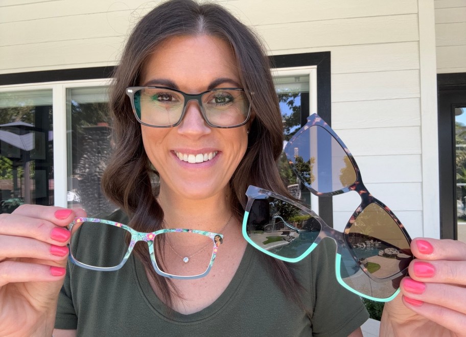 woman holding different lenses to glass frames