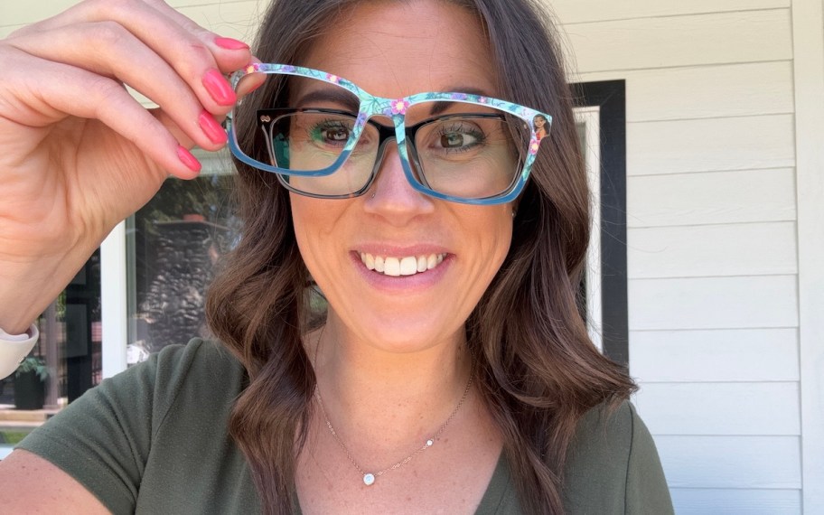 woman taking off glass frames