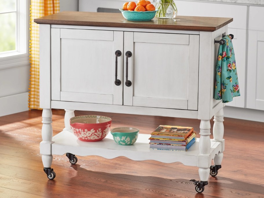 a white kitchen island / cart in a kitchen