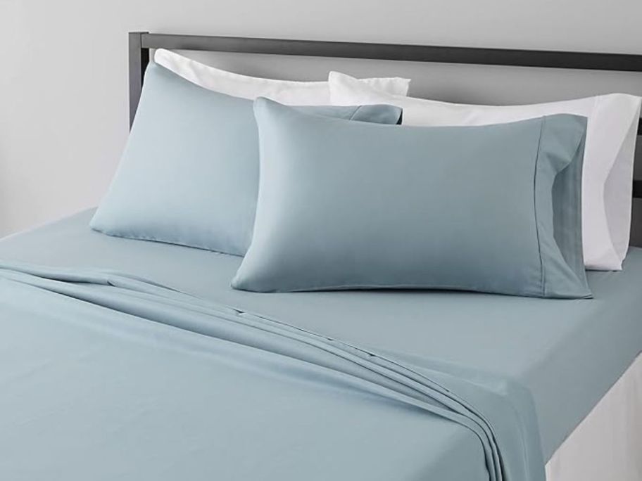 spa blue Amazon Basics 4-Piece Full Sheet Set on bed