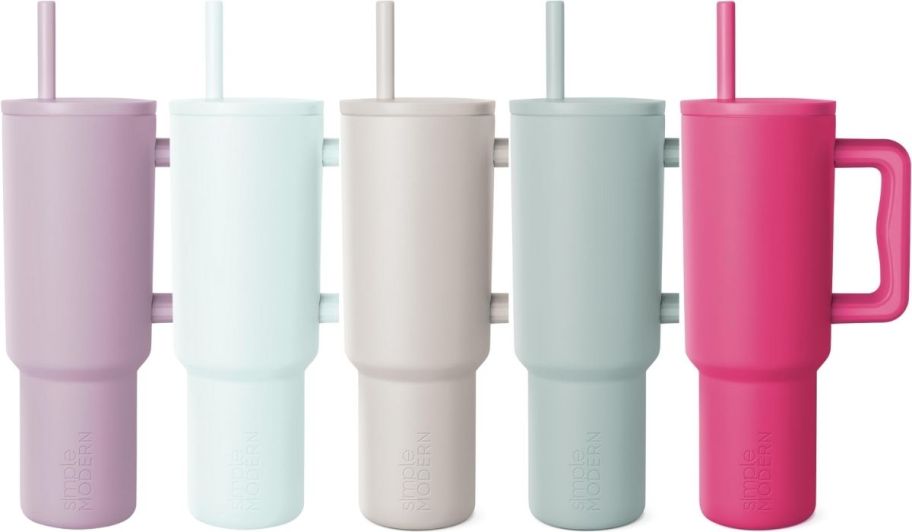 five simple modern tumblers with lids and straws in assorted colors