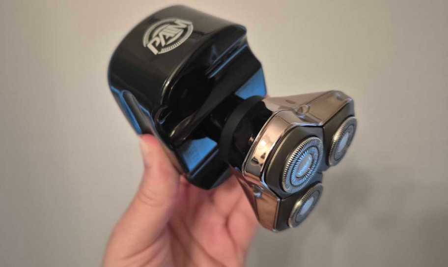 hand holding skull shaver