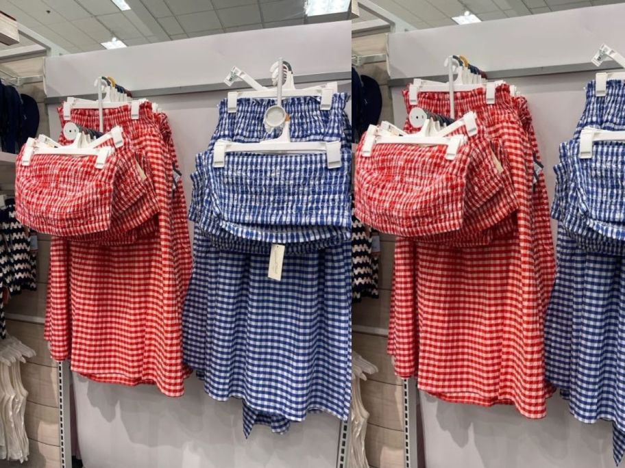 red white and blue dress sets hanging on wall in store
