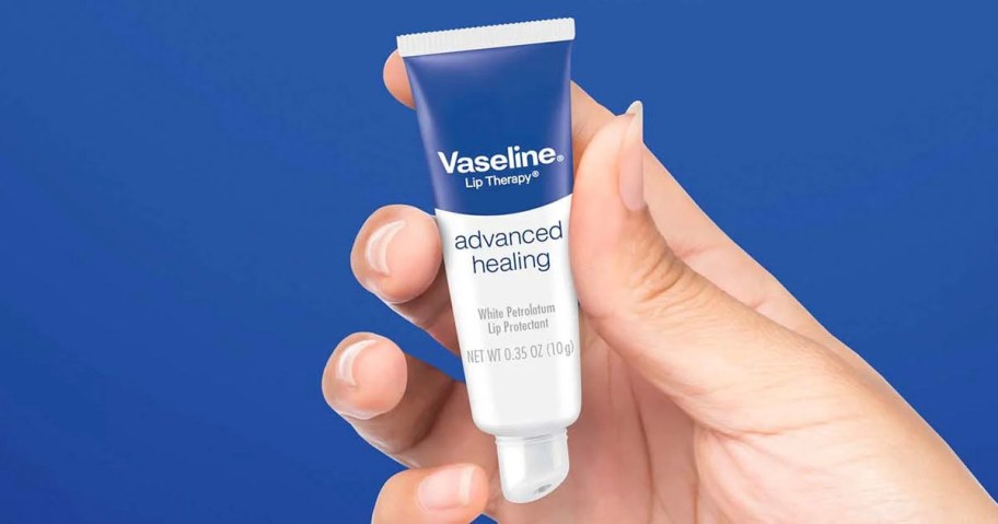hand holding vaseline lip balm tube 