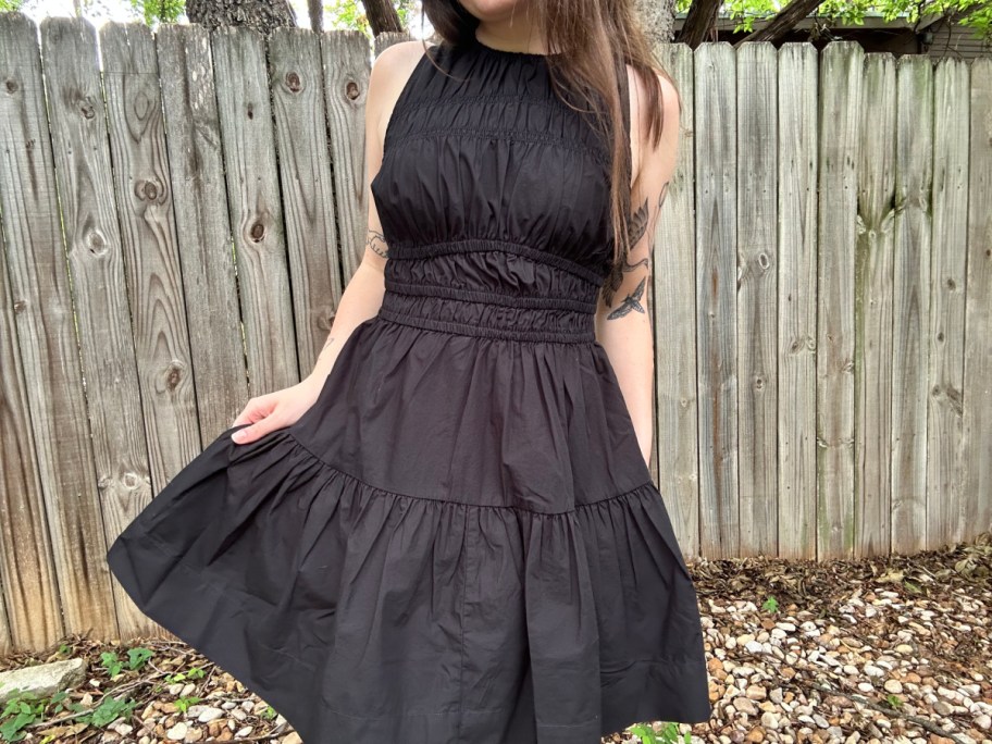 woman in black smocked tiered dress