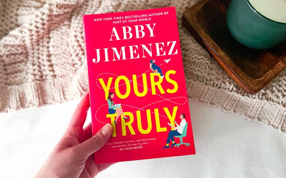 hand holding yours truly book