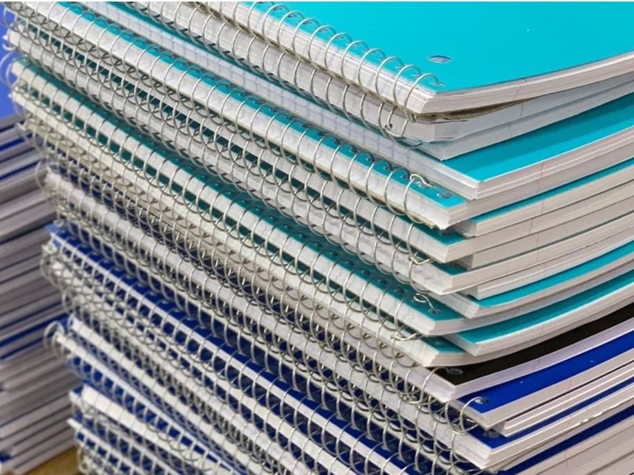 A stack of 1-subject spiral bound notebooks